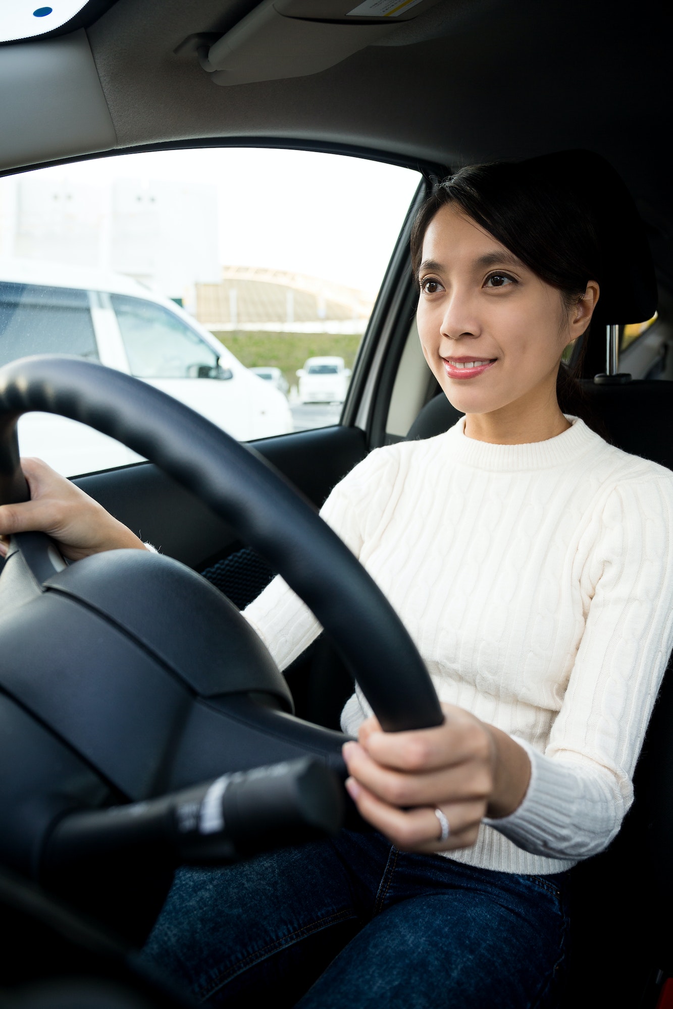 Young woman driving a car